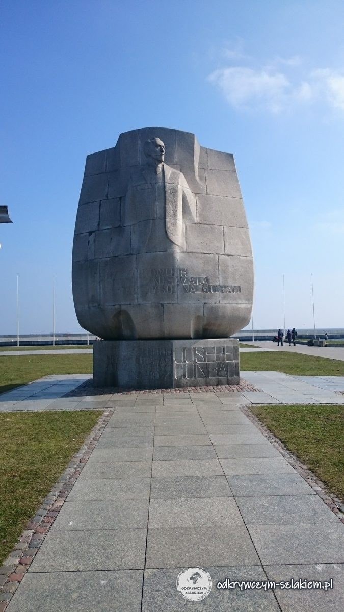The stone Joseph Conrad monument with the carved figure of the writer at the end of the South Pier in Gdynia