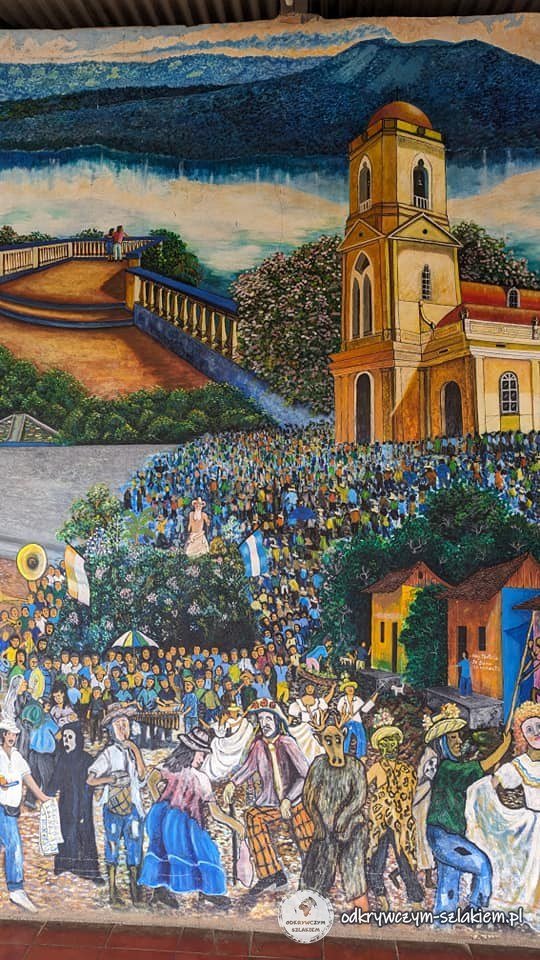 Kolorowy mural z kościołem i ulicznym świętem w mieście Masaya