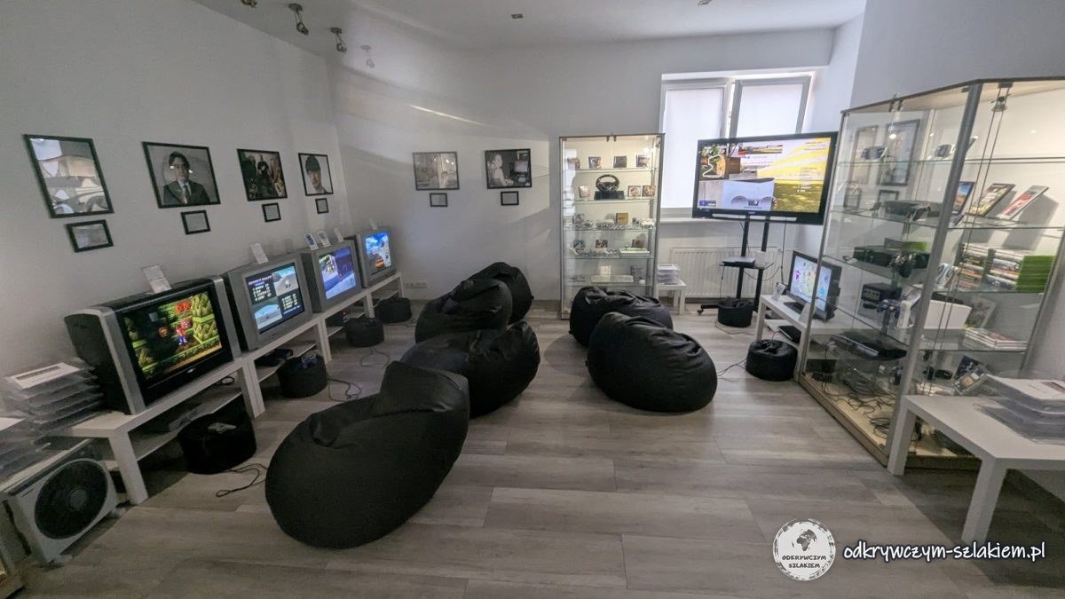 The console room in the Poznań Museum of Games and Computers – TVs with games, beanbags and display cases
