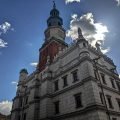 The Renaissance town hall on the Old Market Square in Poznań with its clock tower against a blue sky