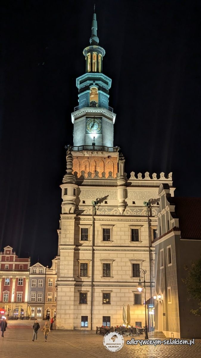 The illuminated town hall in Poznań with its tower at night, on the Old Market Square after renovation